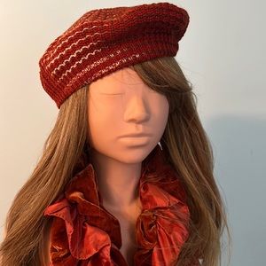 Pumpkin spice and crème colored hat. Can be worn as a beret or low to the back.